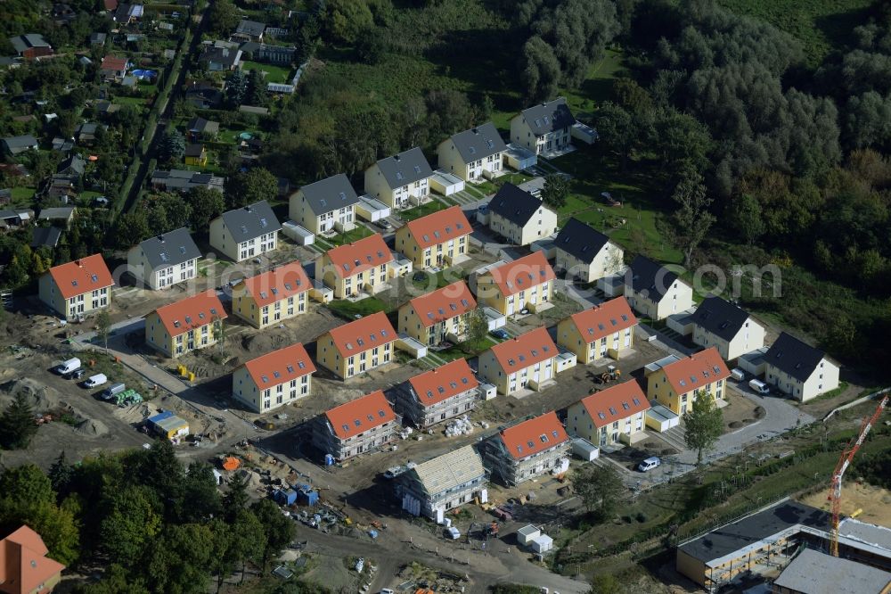 Aerial image Potsdam - Construction site for the new building of a semi-detached houses residential area in the Teltower Vorstadt part of Potsdam in the state Brandenburg. The houses are being built at a wooded area in Nuthewinkel