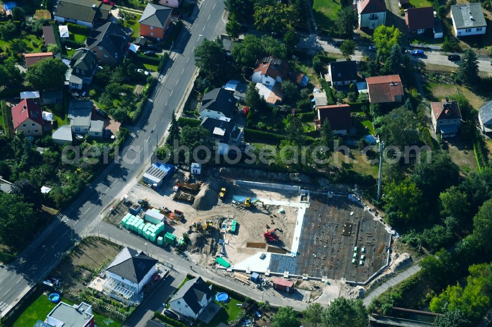 Berlin from the bird's eye view: New construction of the building complex of the shopping center Bismarcksfelderstrasse corner Kaulsdorfer Strasse in Berlin, Germany