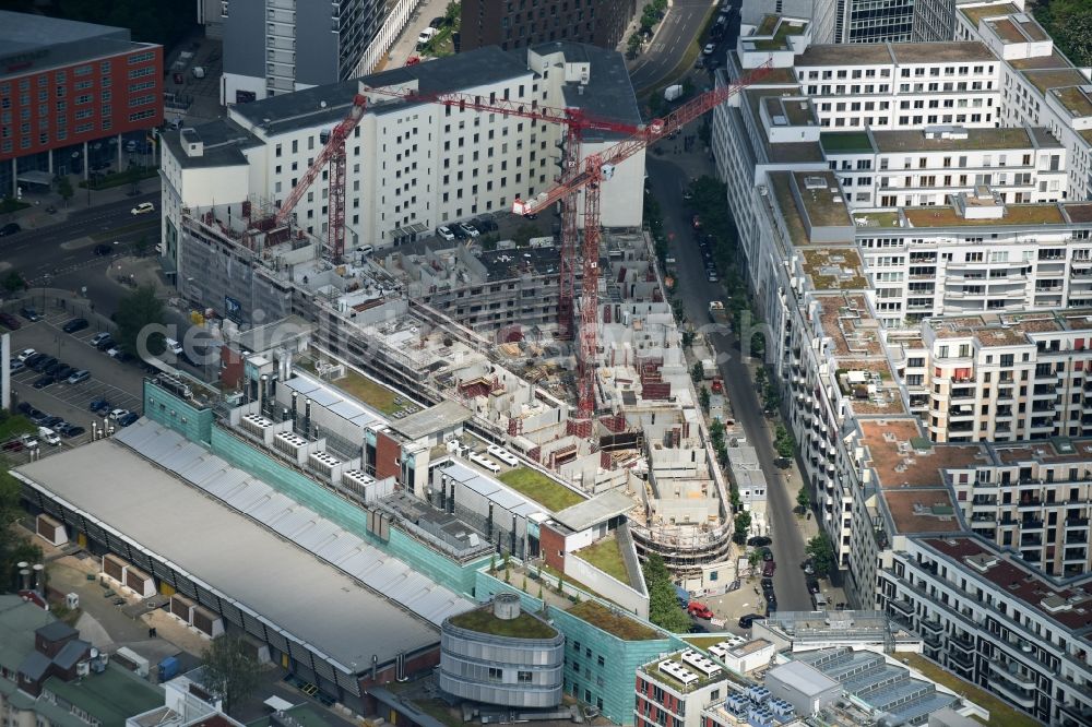 Berlin from above - Construction for the new construction of condominiums and commercial units of the project Living at Spittelmarkt by the construction company Adolf Lupp GmbH + Co KG on the triangular plot around the Kommandantenstrasse and Beuthstrasse in the district Mitte in Berlin, Germany. The client is the PANDION AG