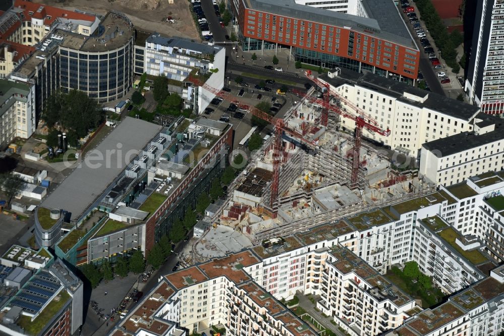 Berlin from the bird's eye view: Construction for the new construction of condominiums and commercial units of the project Living at Spittelmarkt by the construction company Adolf Lupp GmbH + Co KG on the triangular plot around the Kommandantenstrasse and Beuthstrasse in the district Mitte in Berlin, Germany. The client is the PANDION AG