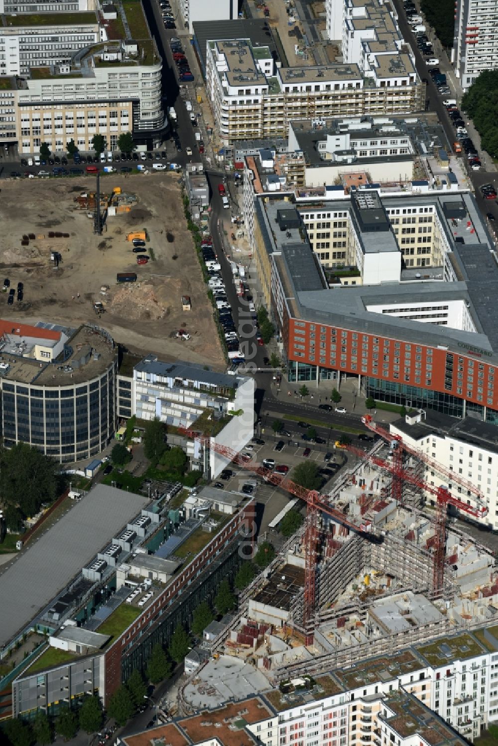 Aerial photograph Berlin - Construction for the new construction of condominiums and commercial units of the project Living at Spittelmarkt by the construction company Adolf Lupp GmbH + Co KG on the triangular plot around the Kommandantenstrasse and Beuthstrasse in the district Mitte in Berlin, Germany. The client is the PANDION AG