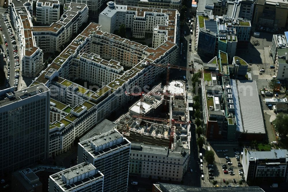 Berlin from the bird's eye view: Construction for the new construction of condominiums and commercial units of the project Living at Spittelmarkt by the construction company Adolf Lupp GmbH + Co KG on the triangular plot around the Kommandantenstrasse and Beuthstrasse in the district Mitte in Berlin, Germany. The client is the PANDION AG