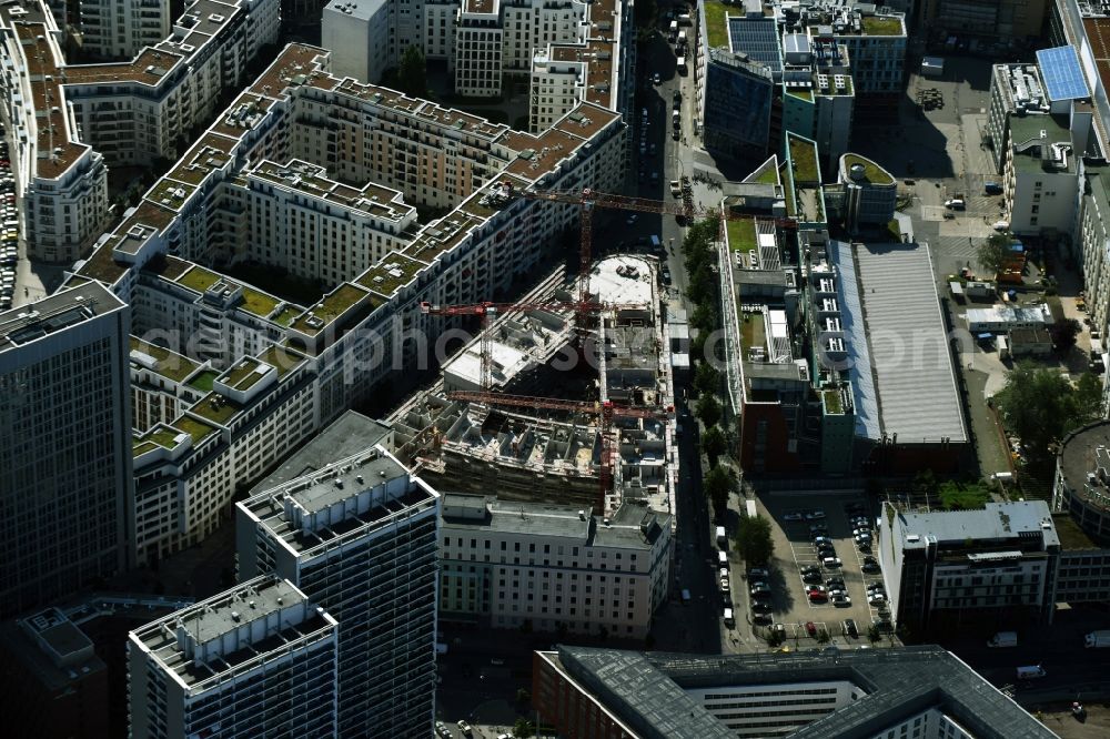 Aerial photograph Berlin - Construction for the new construction of condominiums and commercial units of the project Living at Spittelmarkt by the construction company Adolf Lupp GmbH + Co KG on the triangular plot around the Kommandantenstrasse and Beuthstrasse in the district Mitte in Berlin, Germany. The client is the PANDION AG