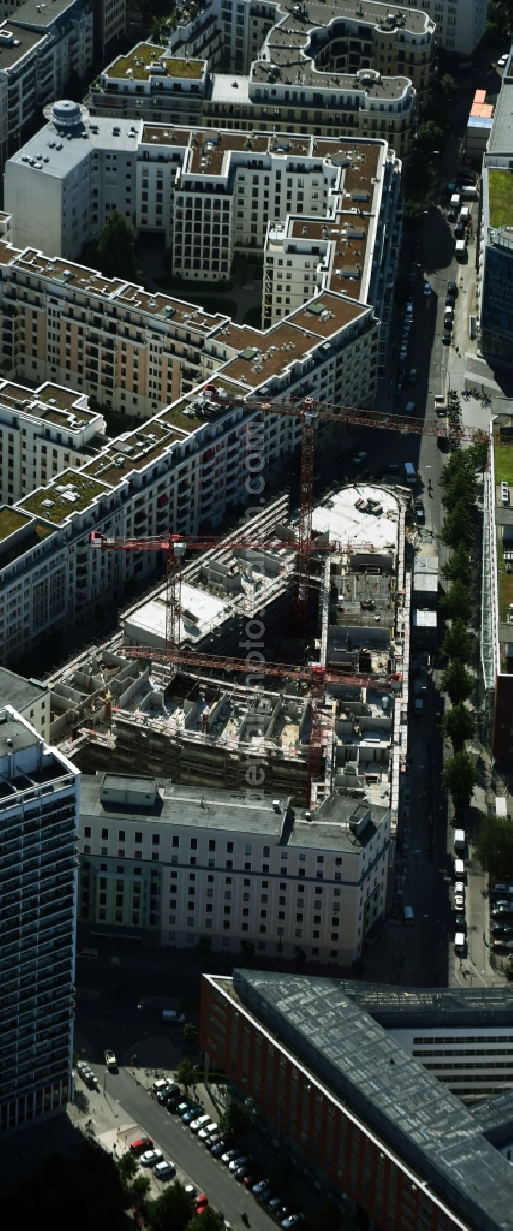 Berlin from the bird's eye view: Construction for the new construction of condominiums and commercial units of the project Living at Spittelmarkt by the construction company Adolf Lupp GmbH + Co KG on the triangular plot around the Kommandantenstrasse and Beuthstrasse in the district Mitte in Berlin, Germany. The client is the PANDION AG