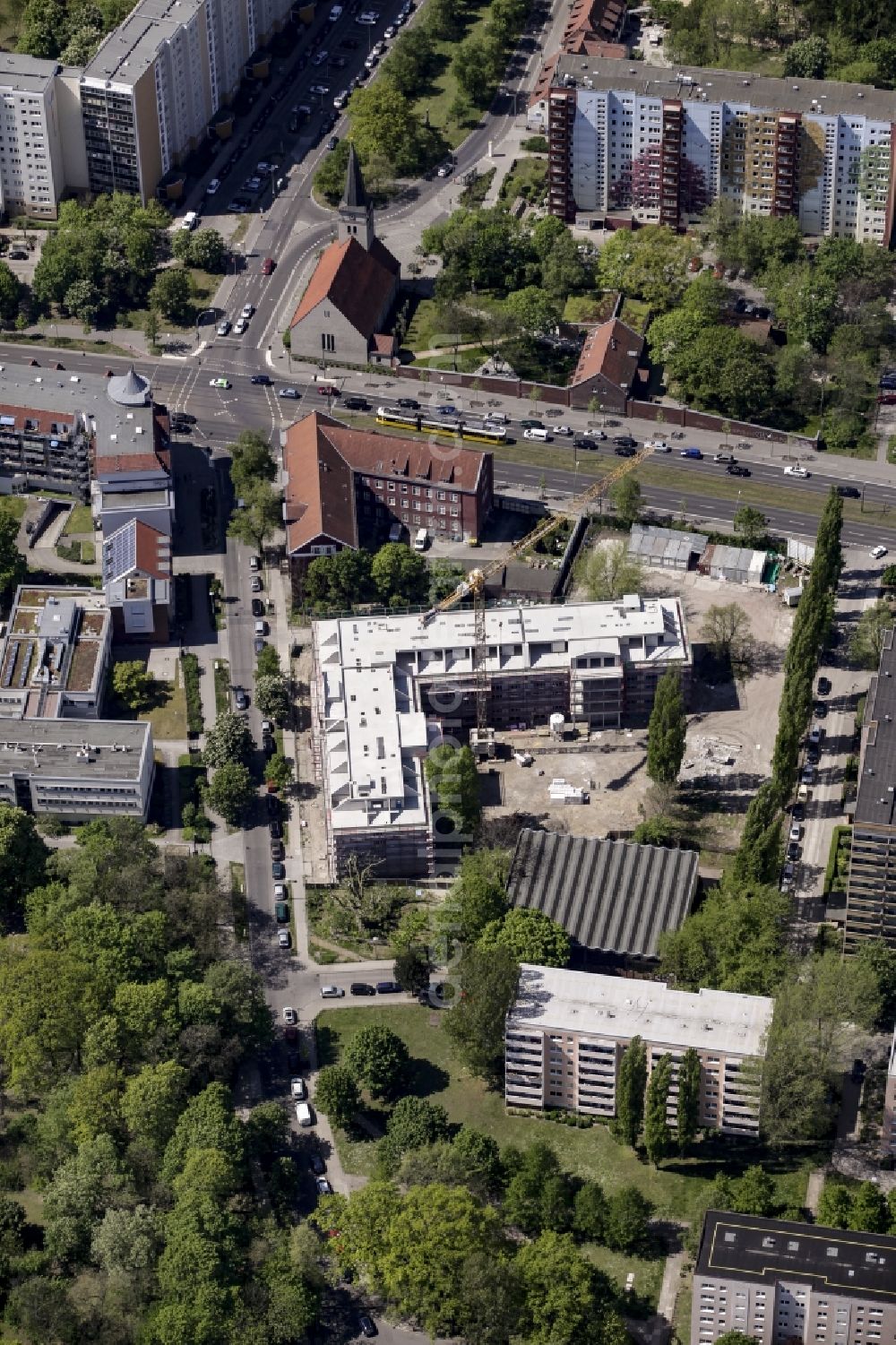 Berlin from the bird's eye view: Construction site of a new DOMICIL care and nursing home for the elderly on Alfred-Kowalke-Strasse in the district of Lichtenberg in Berlin, Germany. Its owner is HBB Hanseatische Gesellschaft fuer Seniorenheime mbH & Co. KG, BATEG GmbH is the main developer