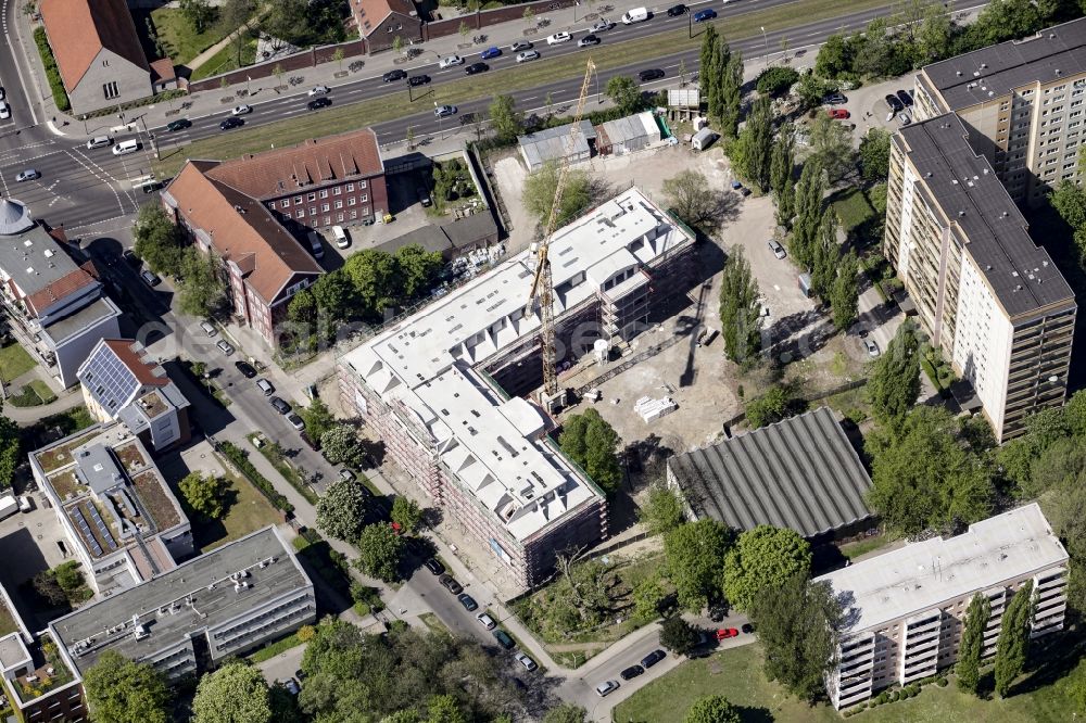 Aerial photograph Berlin - Construction site of a new DOMICIL care and nursing home for the elderly on Alfred-Kowalke-Strasse in the district of Lichtenberg in Berlin, Germany. Its owner is HBB Hanseatische Gesellschaft fuer Seniorenheime mbH & Co. KG, BATEG GmbH is the main developer