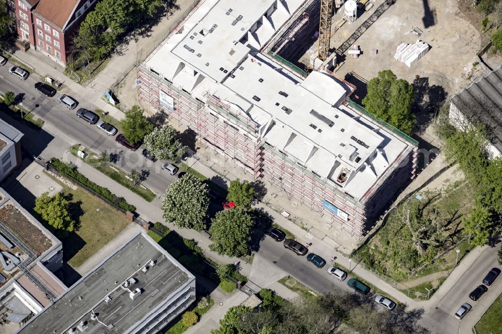 Berlin from the bird's eye view: Construction site of a new DOMICIL care and nursing home for the elderly on Alfred-Kowalke-Strasse in the district of Lichtenberg in Berlin, Germany. Its owner is HBB Hanseatische Gesellschaft fuer Seniorenheime mbH & Co. KG, BATEG GmbH is the main developer