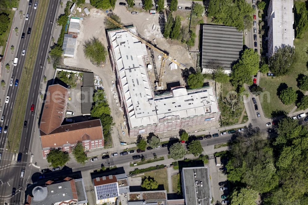 Aerial photograph Berlin - Construction site of a new DOMICIL care and nursing home for the elderly on Alfred-Kowalke-Strasse in the district of Lichtenberg in Berlin, Germany. Its owner is HBB Hanseatische Gesellschaft fuer Seniorenheime mbH & Co. KG, BATEG GmbH is the main developer