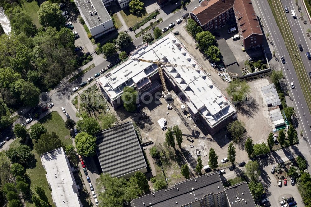 Berlin from the bird's eye view: Construction site of a new DOMICIL care and nursing home for the elderly on Alfred-Kowalke-Strasse in the district of Lichtenberg in Berlin, Germany. Its owner is HBB Hanseatische Gesellschaft fuer Seniorenheime mbH & Co. KG, BATEG GmbH is the main developer