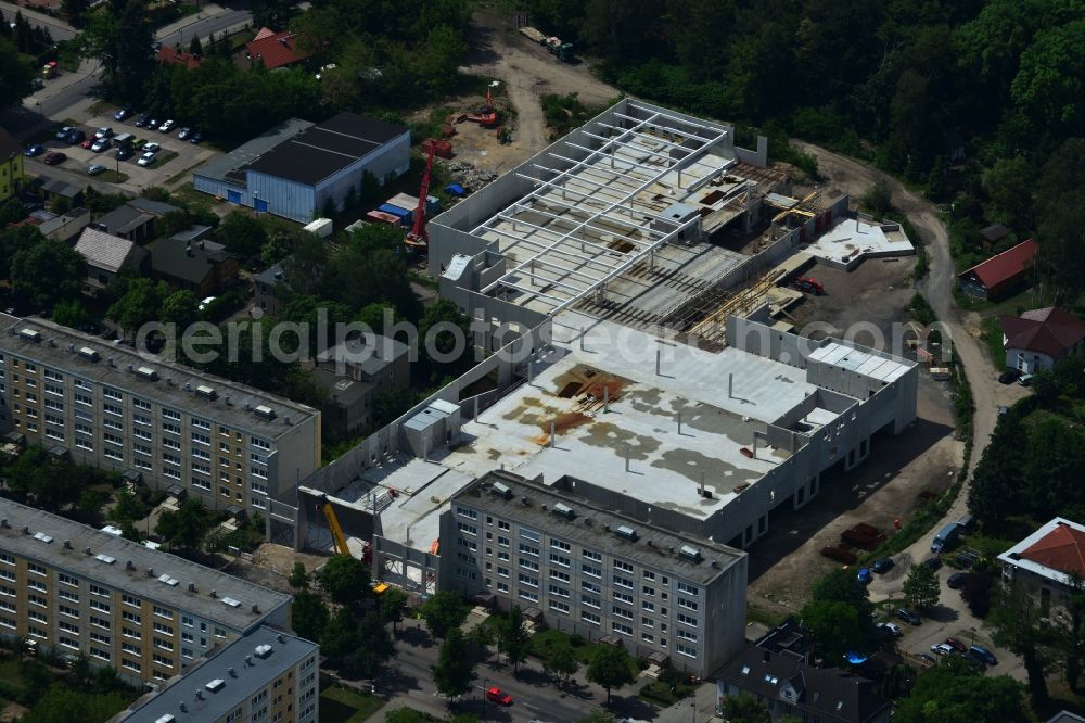 Aerial image Erkner - Construction site for the new building of the shopping center City center on Friedrichstrasse - waterfront in Erkner in Brandenburg