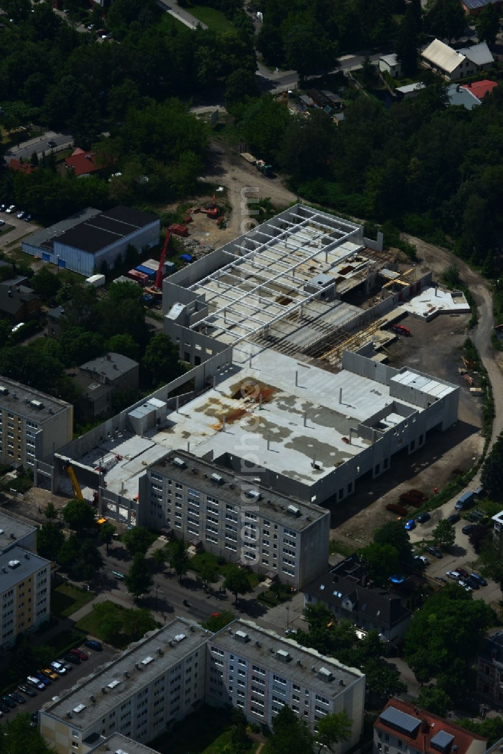 Aerial photograph Erkner - Construction site for the new building of the shopping center City center on Friedrichstrasse - waterfront in Erkner in Brandenburg