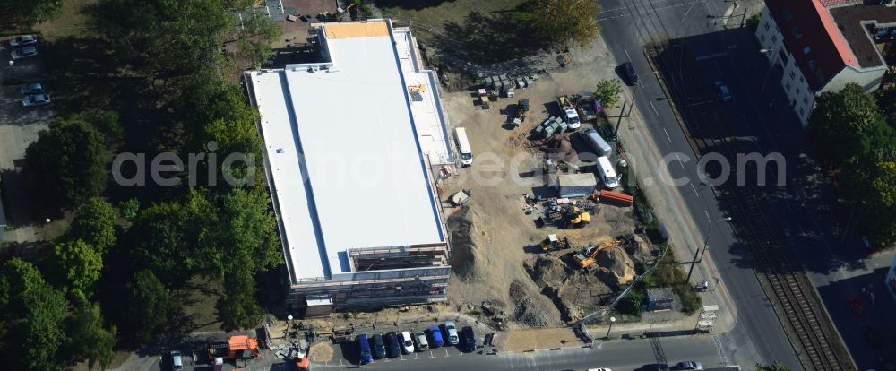 Berlin from the bird's eye view: Construction site to build a new discounter shopping center at the corner Hoernlestrasse Mahlsdorfer street in the Koepenick district of Berlin