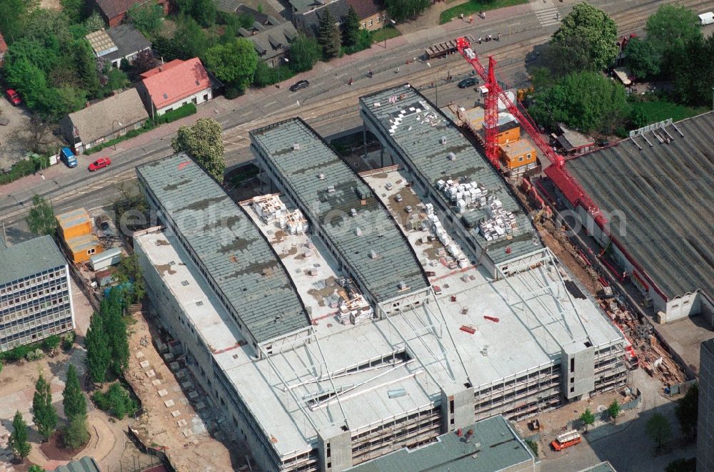 Berlin Hohenschönhausen from above - Construction site for the new building of the shopping center Storchenhof MÜBAU Baugesellschaft mbH on the Hauptstrasse in Berlin - Hohenschonhausen