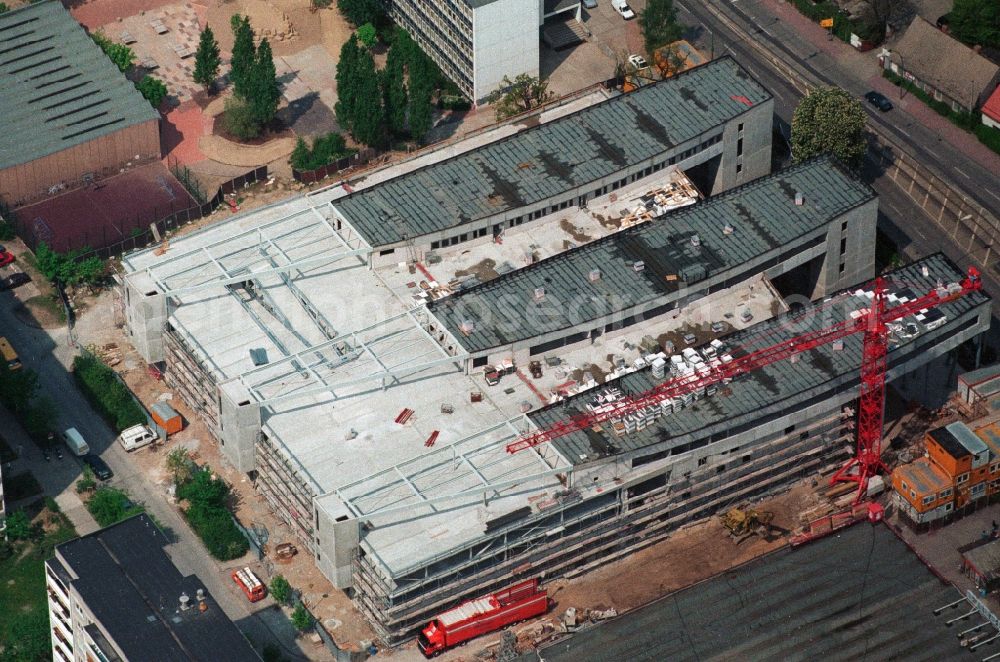 Berlin Hohenschönhausen from the bird's eye view: Construction site for the new building of the shopping center Storchenhof MÜBAU Baugesellschaft mbH on the Hauptstrasse in Berlin - Hohenschonhausen