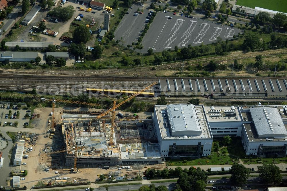 Oranienburg from above - Construction site for the new construction and expansion of Takeda GmbH at the Lehnitzstrasse in Oranienburg in Brandenburg. The construction company Ed. Zueblin AG built on the site of the pharmaceutical company at the Lehnitzstrasse a modern production and research facilities