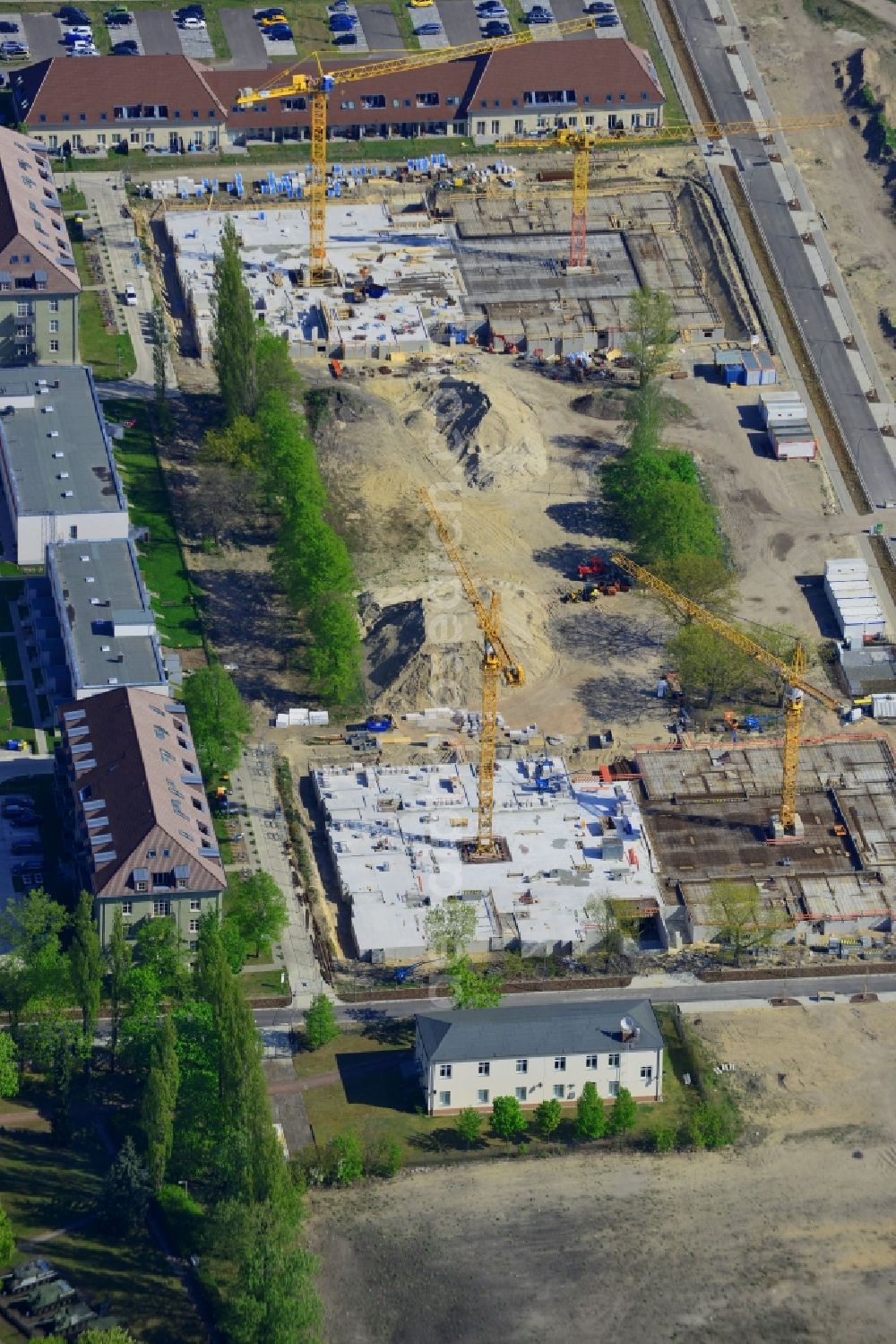 Berlin from above - Construction site for a residential area in Karlshorst in the Lichtenberg district of Berlin in Germany. The development of InCasa project with semi-detached houses and residential areas is located on site of the historic military base in Karlshorst