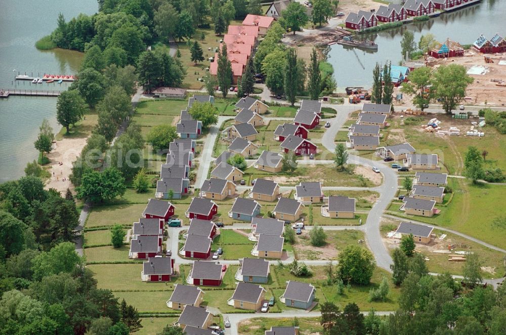 Wendisch Rietz from the bird's eye view: Building site of the holiday house plant of the park Ferienpark Scharmuetzelsee Betriebs-GbR on Strandstrasse in Wendisch Rietz in the state Brandenburg