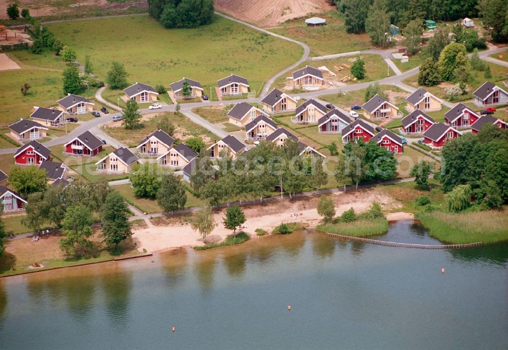 Wendisch Rietz from the bird's eye view: Building site of the holiday house plant of the park Ferienpark Scharmuetzelsee Betriebs-GbR on Strandstrasse in Wendisch Rietz in the state Brandenburg