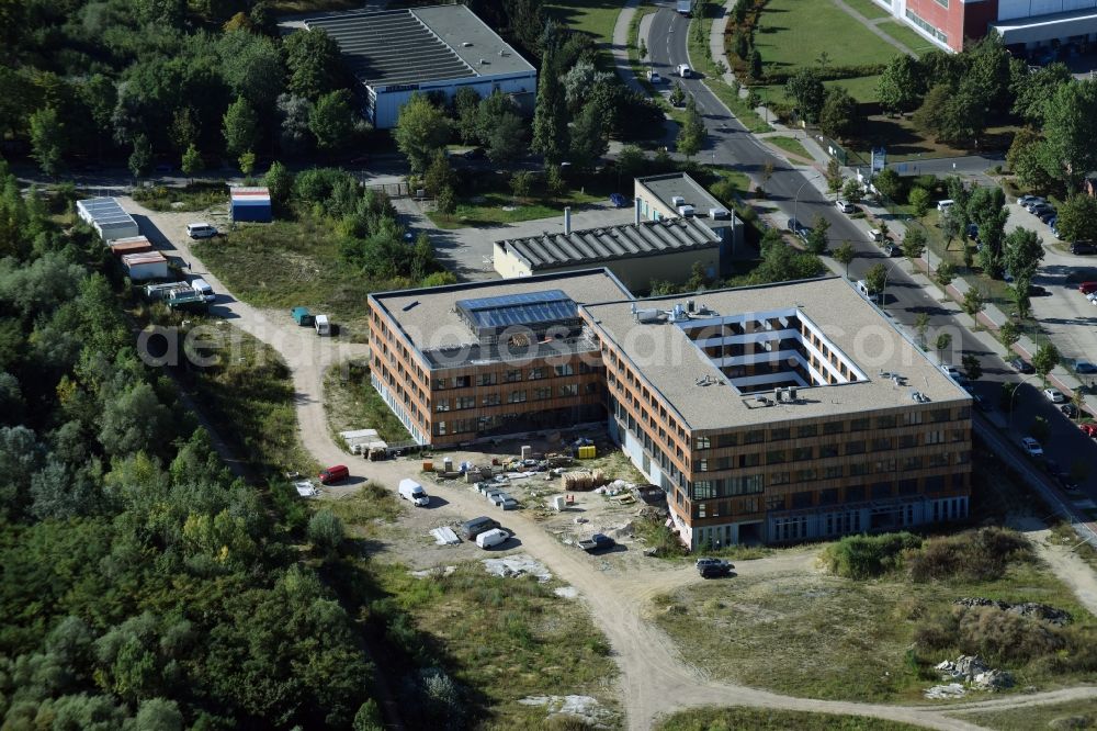 Aerial image Berlin - Construction site of the new company building of Flexim GmbH with a wooden facade on Boxberger Strasse in the district of Marzahn-Hellersdorf in Berlin