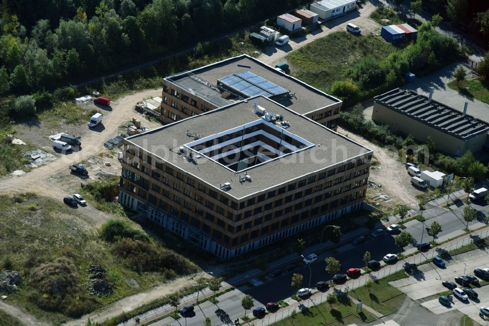 Aerial image Berlin - Construction site of the new company building of Flexim GmbH with a wooden facade on Boxberger Strasse in the district of Marzahn-Hellersdorf in Berlin