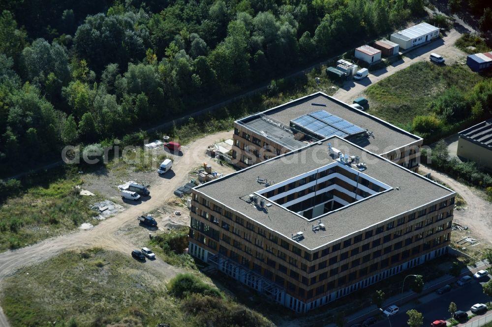 Aerial photograph Berlin - Construction site of the new company building of Flexim GmbH with a wooden facade on Boxberger Strasse in the district of Marzahn-Hellersdorf in Berlin