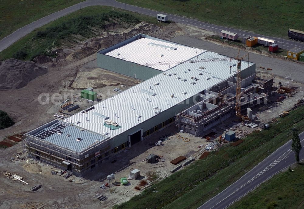 Forst from the bird's eye view: Construction site for a new company building in the industrial area on the ring road of the B112 in Forst in Brandenburg