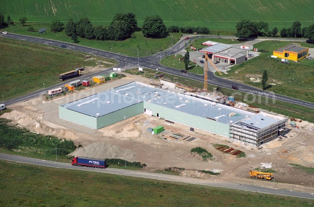 Aerial photograph Forst - Construction site for a new company building in the industrial area on the ring road of the B112 in Forst in Brandenburg