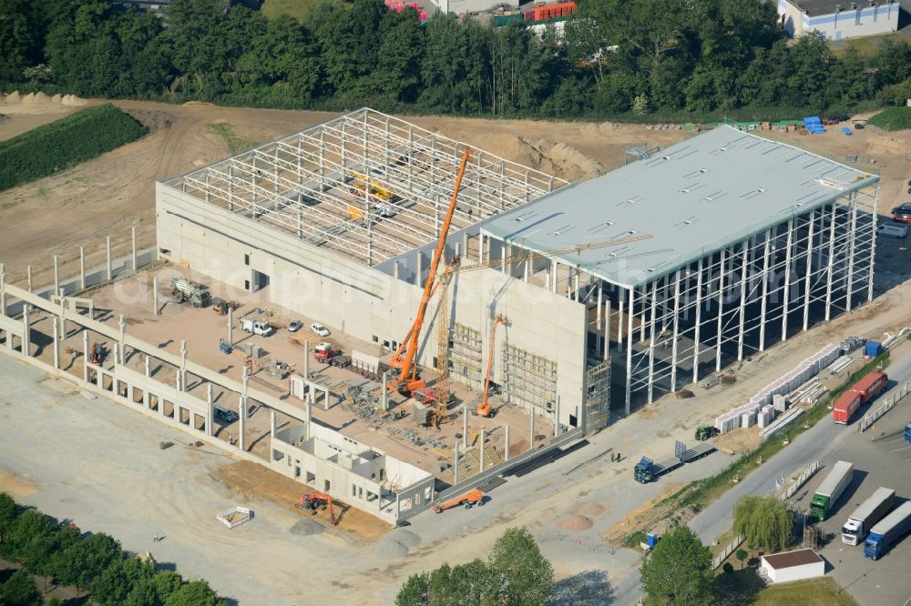 Gütersloh from the bird's eye view: Construction site for the new building Auto Meyer in Guetersloh in the state North Rhine-Westphalia