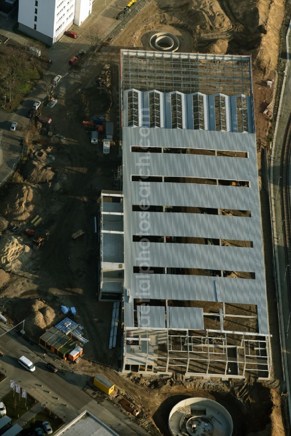 Berlin from above - Construction site for new construction building of the construction market of OBI GmbH & Co. Deutschland KG an der Buchberger Strasse im Stadtteil Lichtenberg in Berlin in Germany