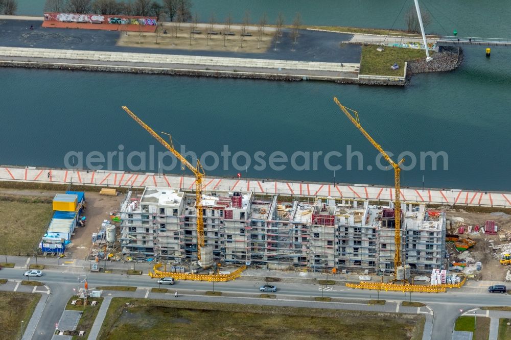 Gelsenkirchen from the bird's eye view: Construction site for the new building eines Gebaeudekomplex of Hofschroeer Projektbau GmbH & Co. KG on Johannes-Rau-Allee in Gelsenkirchen in the state North Rhine-Westphalia, Germany