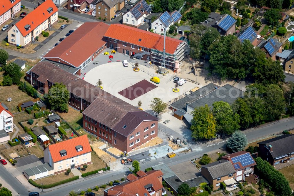 Werne from the bird's eye view: Construction site for the construction of a new building complex on the school grounds of the Uhlandschule in Werne in the federal state of North Rhine-Westphalia, Germany