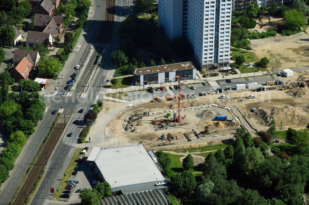 Aerial photograph Berlin - New construction of the building complex of the shopping center Am Anger on Allee of Kosmonauten - Baerensteinstrasse in the district Marzahn in Berlin, Germany