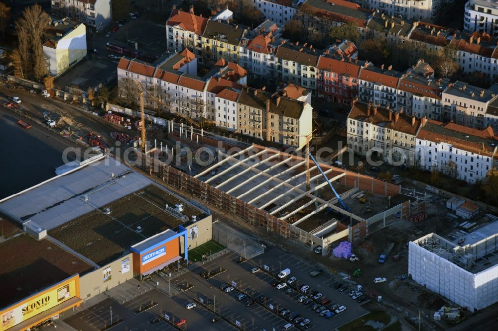 Aerial image Berlin - Construction site for the new building complex of the shopping center at Brueckenstrasse in the district of Schoeneweide in Berlin