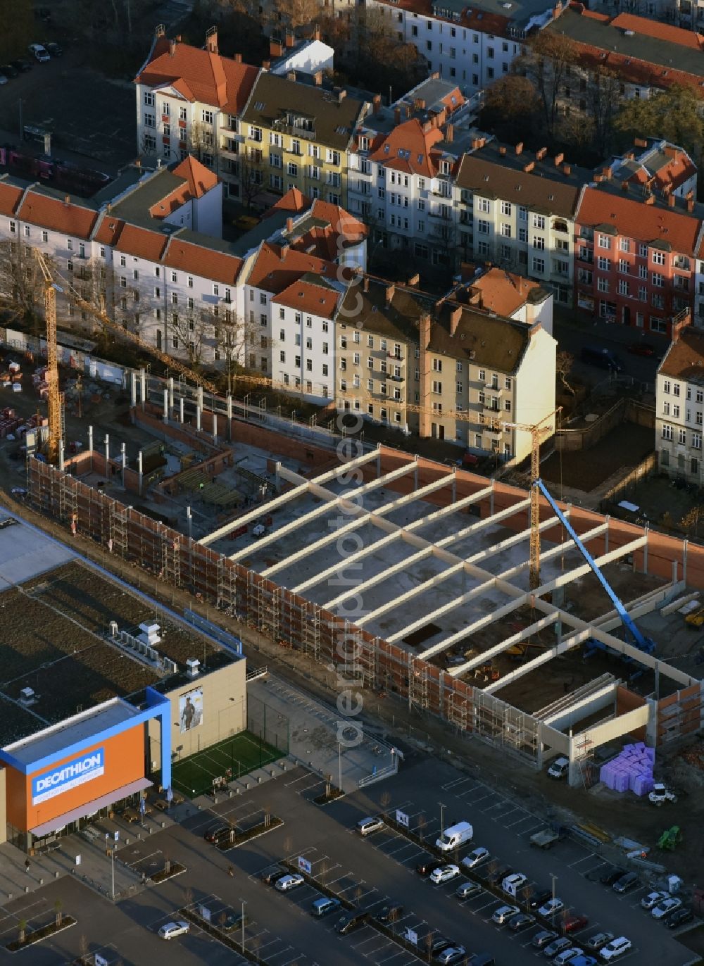 Aerial photograph Berlin - Construction site for the new building complex of the shopping center at Brueckenstrasse in the district of Schoeneweide in Berlin