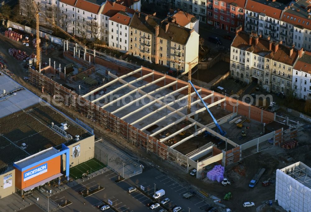 Berlin from the bird's eye view: Construction site for the new building complex of the shopping center at Brueckenstrasse in the district of Schoeneweide in Berlin