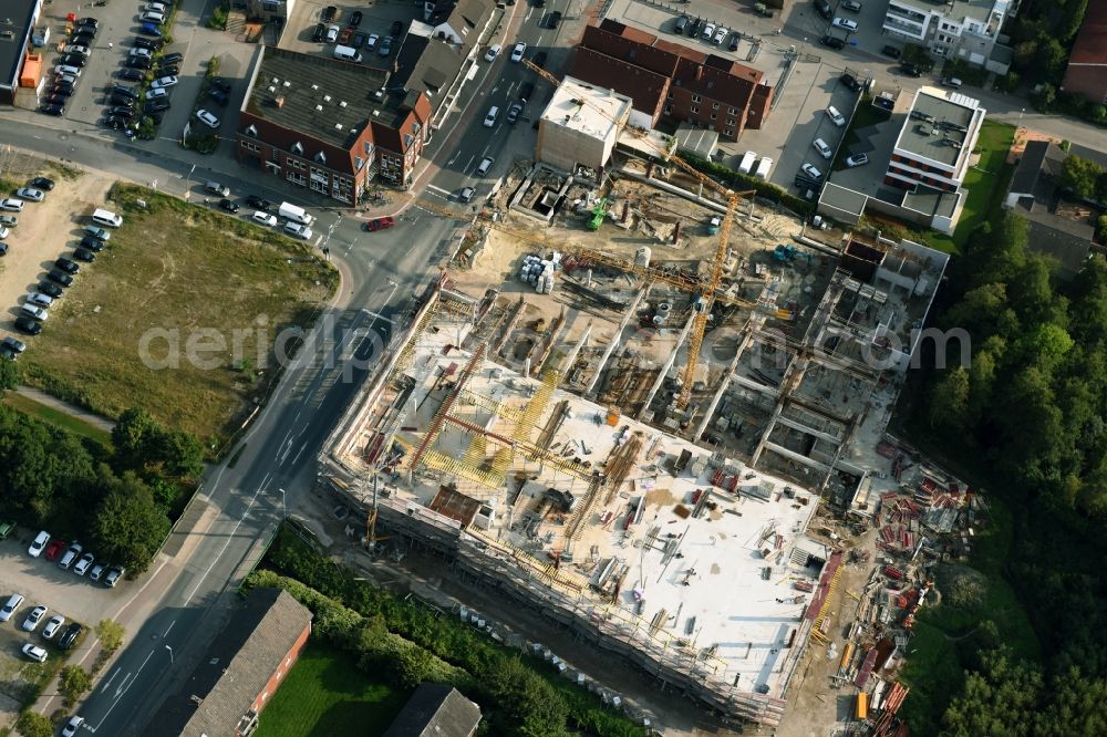 Aerial photograph Cloppenburg - Construction site for the new building complex of the shopping center Carre Cloppenburg by the GENOS Carre Cloppenburg GmbH, designed by Grieshop, Hamza Architekten in Cloppenburg, Lower Saxony