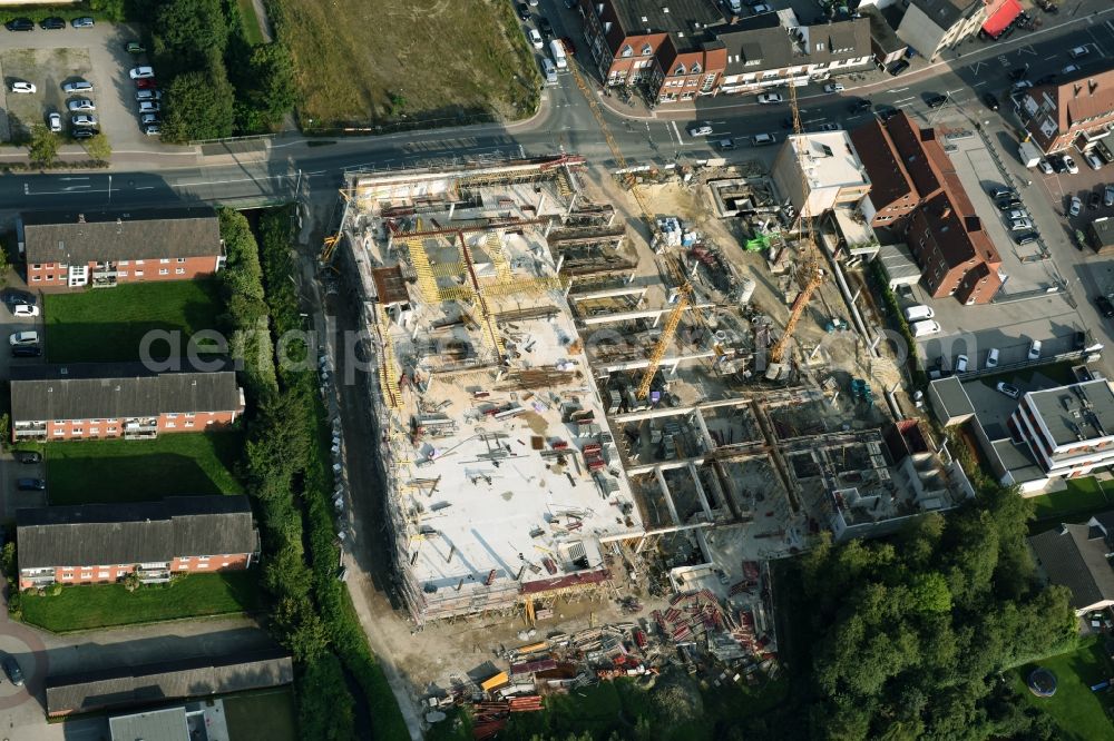 Cloppenburg from the bird's eye view: Construction site for the new building complex of the shopping center Carre Cloppenburg by the GENOS Carre Cloppenburg GmbH, designed by Grieshop, Hamza Architekten in Cloppenburg, Lower Saxony