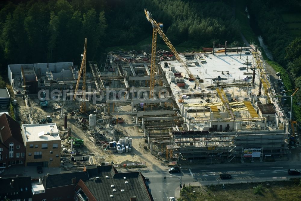 Cloppenburg from the bird's eye view: Construction site for the new building complex of the shopping center Carre Cloppenburg by the GENOS Carre Cloppenburg GmbH, designed by Grieshop, Hamza Architekten in Cloppenburg, Lower Saxony