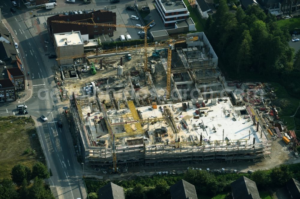 Cloppenburg from the bird's eye view: Construction site for the new building complex of the shopping center Carre Cloppenburg by the GENOS Carre Cloppenburg GmbH, designed by Grieshop, Hamza Architekten in Cloppenburg, Lower Saxony