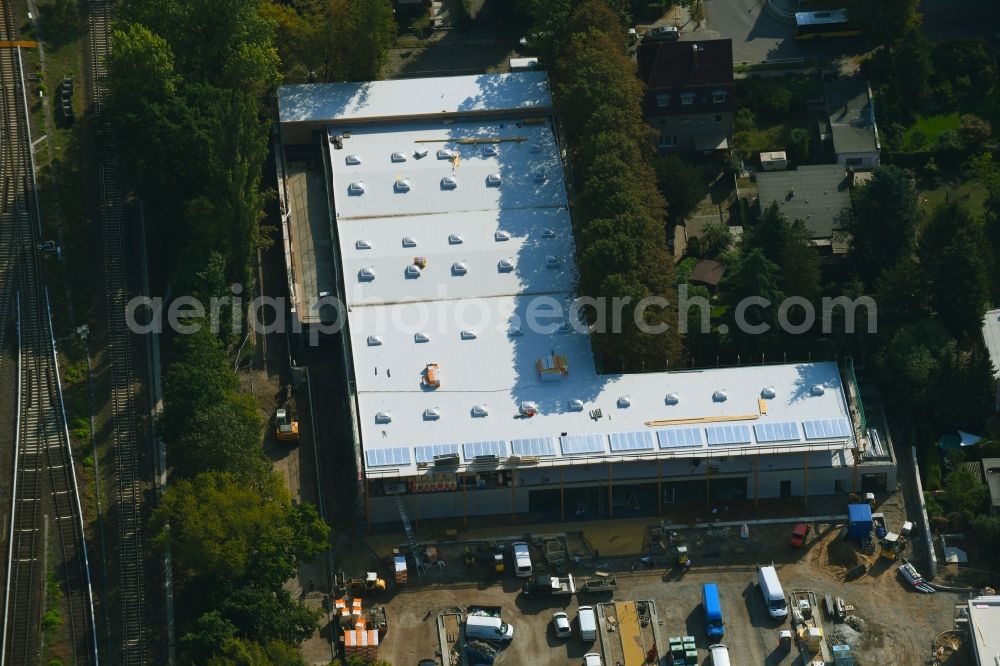 Berlin from above - New construction of the building complex of the shopping center on Hoenower Strasse in the district Mahlsdorf in Berlin, Germany