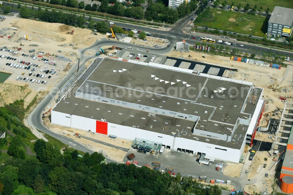 Berlin from above - New construction of the building complex of the shopping center of Hoeffner Moebelgesellschaft GmbH & Co.KG and the Krieger-Gruppe on Landsberger Allee in Berlin