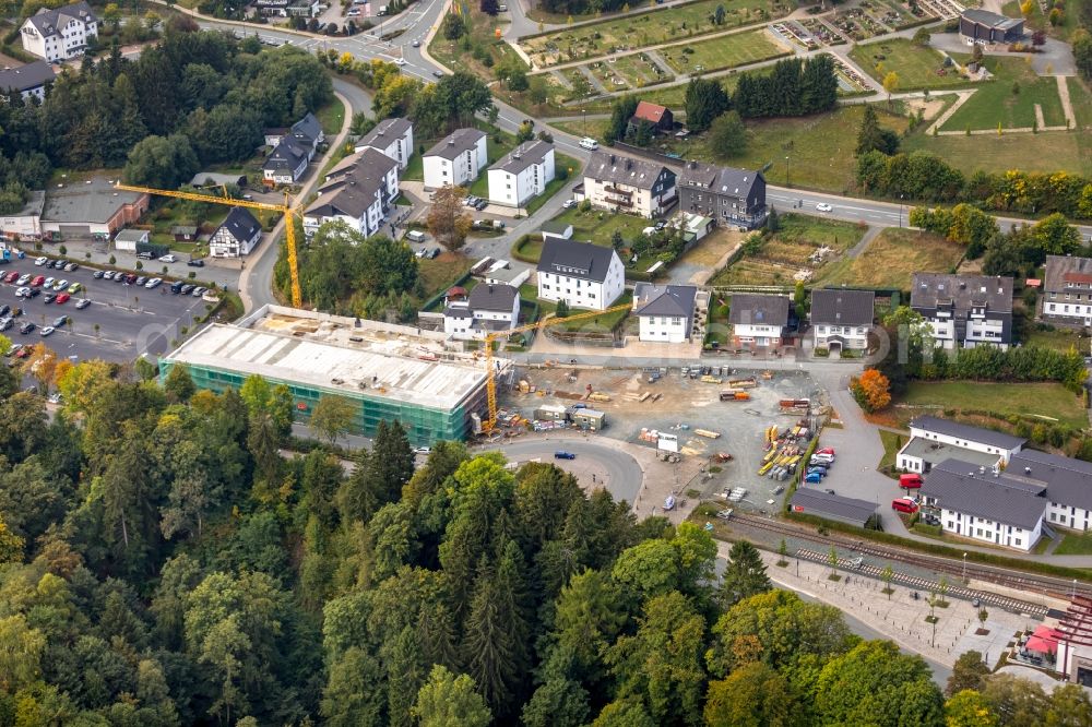 Winterberg from the bird's eye view: New construction of the building complex of the shopping center Neue Mitte 3 in Winterberg in the state North Rhine-Westphalia, Germany