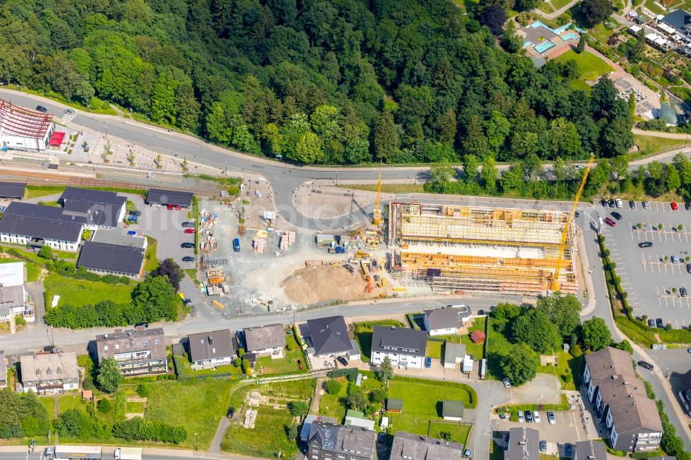 Winterberg from the bird's eye view: New construction of the building complex of the shopping center Neue Mitte 3 in Winterberg in the state North Rhine-Westphalia, Germany