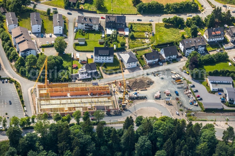 Aerial photograph Winterberg - New construction of the building complex of the shopping center Neue Mitte 3 in Winterberg in the state North Rhine-Westphalia, Germany