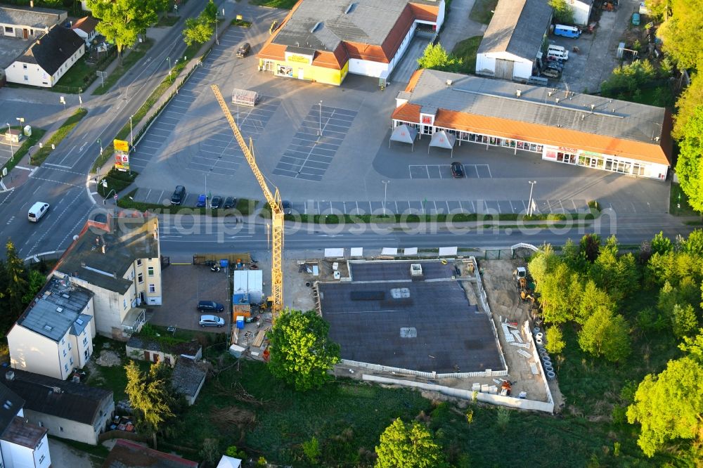 Aerial photograph Werneuchen - New construction of the building complex of the shopping center einer Rossmann-Filiale on Schulstrasse in Werneuchen in the state Brandenburg, Germany