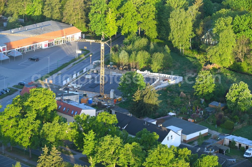 Aerial photograph Werneuchen - New construction of the building complex of the shopping center einer Rossmann-Filiale on Schulstrasse in Werneuchen in the state Brandenburg, Germany