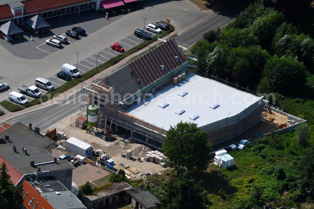 Werneuchen from the bird's eye view: New construction of the building complex of the shopping center einer Rossmann-Filiale on Schulstrasse in Werneuchen in the state Brandenburg, Germany