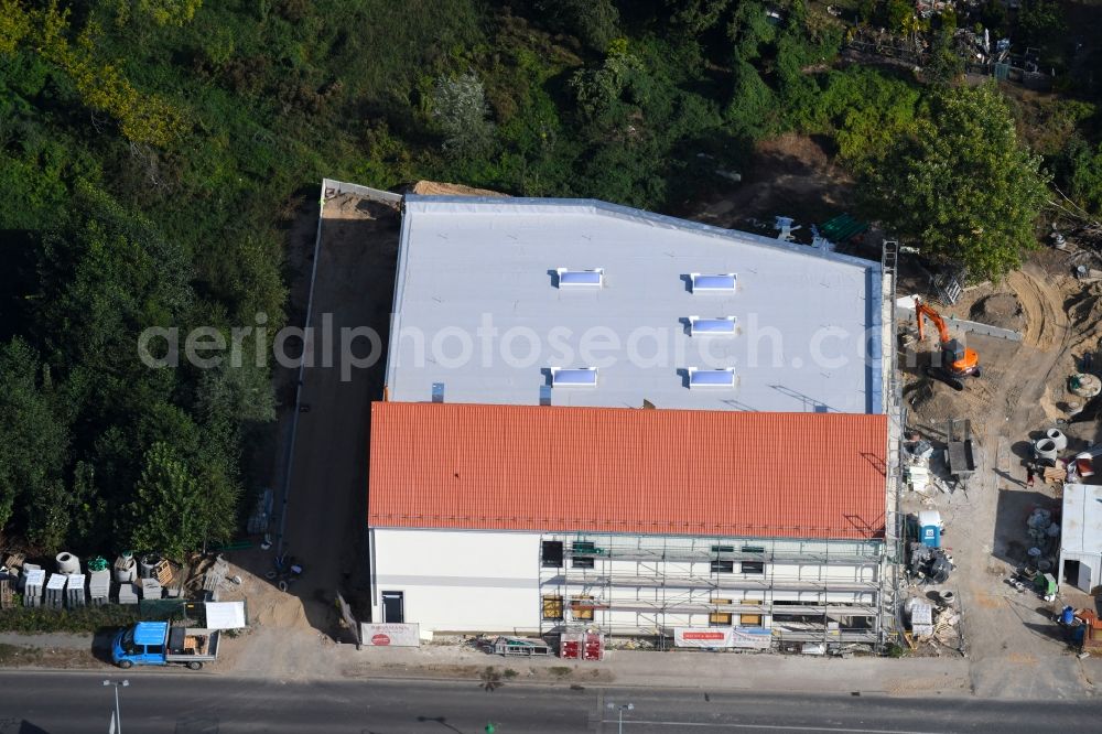 Aerial photograph Werneuchen - New construction of the building complex of the shopping center einer Rossmann-Filiale on Schulstrasse in Werneuchen in the state Brandenburg, Germany