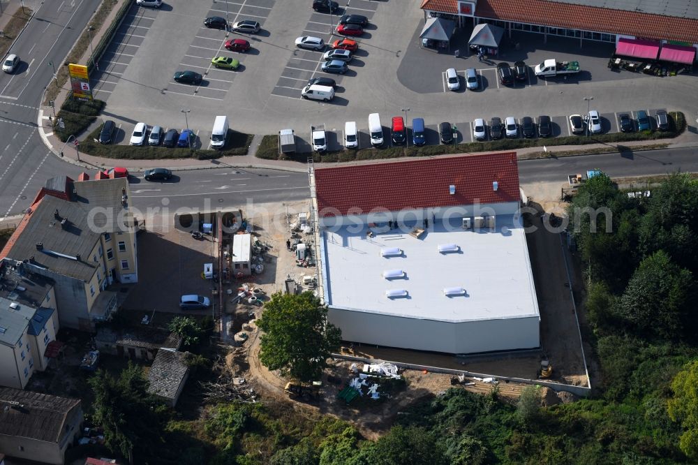 Aerial photograph Werneuchen - New construction of the building complex of the shopping center einer Rossmann-Filiale on Schulstrasse in Werneuchen in the state Brandenburg, Germany