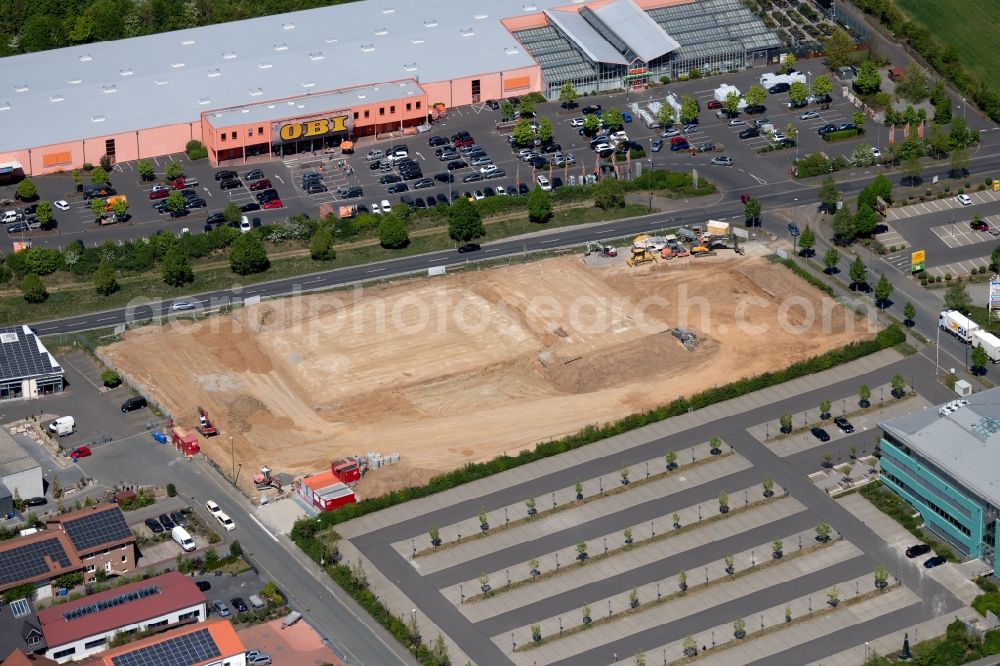 Würzburg from the bird's eye view: New construction of the building complex of the shopping center of Schaumstoffe Wilfried Wegerich GmbH on Ossietzkystrasse - Max-Mengeringhausen-Strasse - Dr.-Johanna-Stahl-Strasse in the district Rottenbauer in Wuerzburg in the state Bavaria, Germany